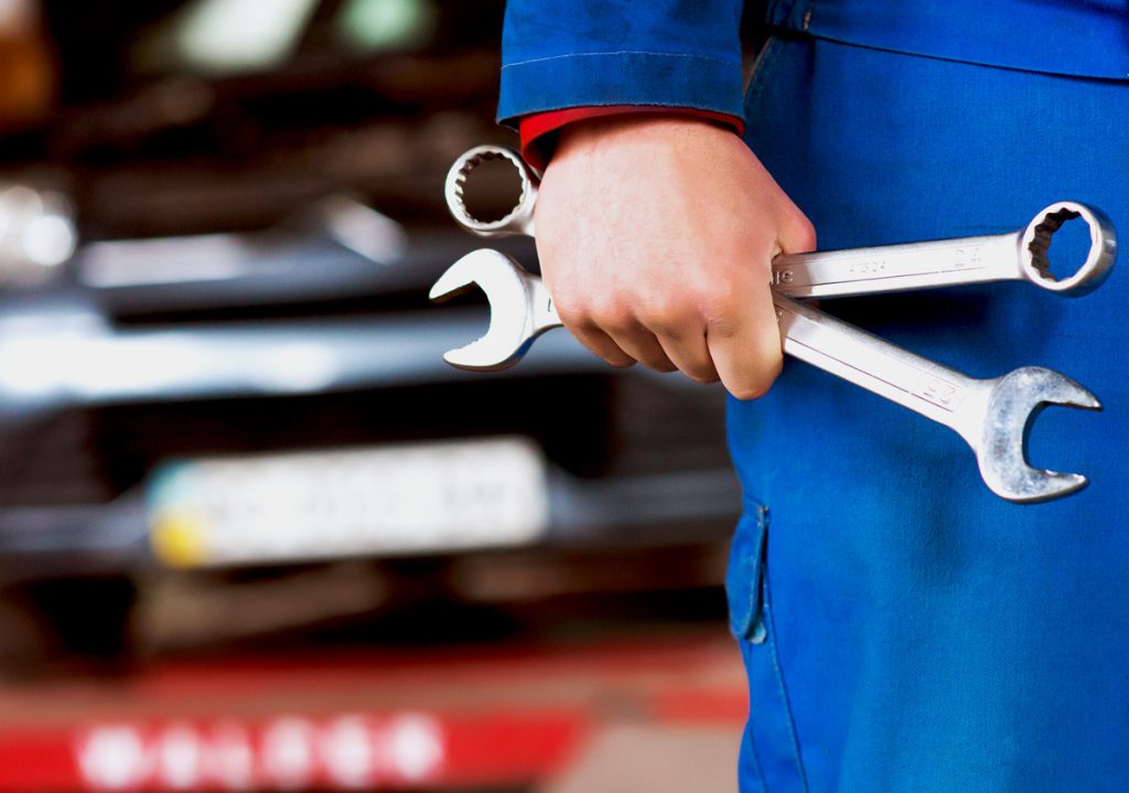 Mechanic holding tools - Car Repairs Havant